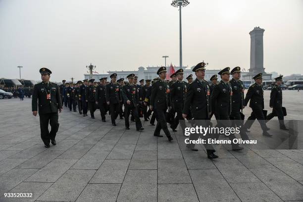 Military delegates arrive to attend the sixth plenary session of the National People's Congress at the Great Hall of the People on March 18, 2018 in...