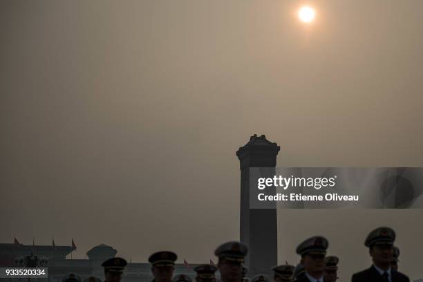 Military delegates arrive to attend the sixth plenary session of the National People's Congress at the Great Hall of the People on March 18, 2018 in...