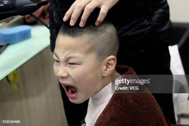 Boy gets a haircut on the Longtaitou Festival on March 18, 2018 in Nanjing, Jiangsu Province of China. As a traditional custom, Chinese people get a...