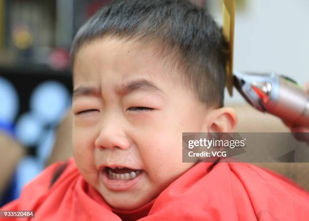 Boy gets a haircut on the Longtaitou Festival on March 18, 2018 in Huaian, Jiangsu Province of China. As a traditional custom, Chinese people get a...