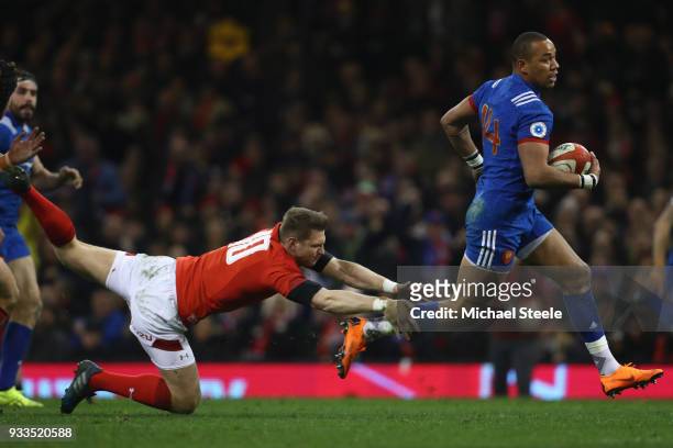 Gael Fickou of France skips past the challenge of Dan Biggar of Wales to score his sides opening try during the NatWest Six Nations match between...