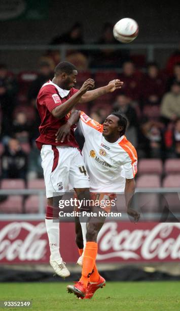 Patrick Kanyuka of Northampton Town challenges for the ball with Calvin Zola of Crewe Alexandra during the Coca Cola League Two Match between...