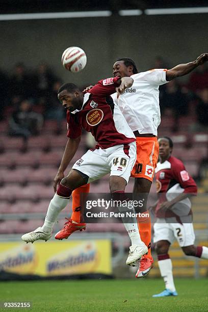 Patrick Kanyuka of Northampton Town challenges for the ball with Calvin Zola of Crewe Alexandra during the Coca Cola League Two Match between...