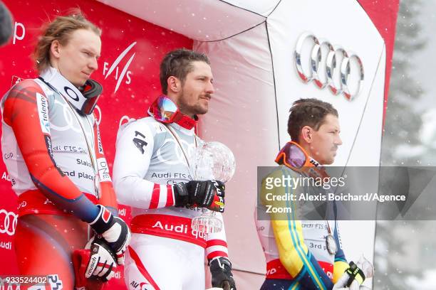 Henrik Kristoffersen of Norway takes 2nd place, Marcel Hirscher of Austria wins the globe, Andre Myhrer of Sweden takes 3rd place during the Audi FIS...