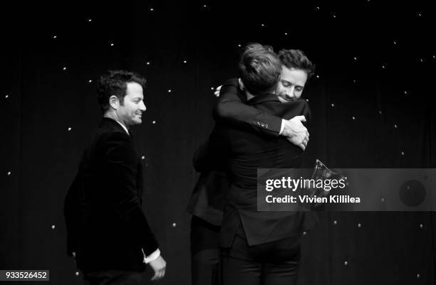 Armie Hammer presents Nate Berkus and Jeremiah Brent an award on stage at Family Equality Council's Impact Awards at The Globe Theatre at Universal...