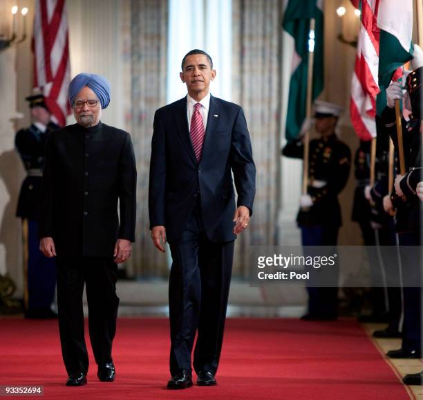 Indian Prime Minister Manmohan Singh , joined by U.S. President Barack Obama , arrives as they participate in a state arrival ceremony in the East...