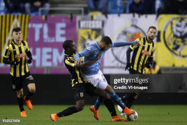 , Lassane Faye of Vitesse, Brandley Kuwas of Heracles Almelo during the Dutch Eredivisie match between Vitesse Arnhem and Heracles Almelo at...