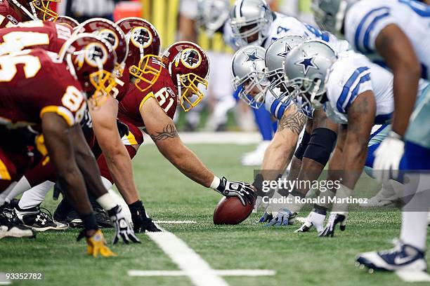 The Washington Redskins offensive line prepares to snap the ball against the Dallas Cowboys at Cowboys Stadium on November 22, 2009 in Arlington,...