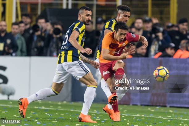 Mehmet Topal of Fenerbahce SK, Yuto Nagatomo of Galatasaray SK, Nabil Dirar of Fenerbahce SK during the Turkish Spor Toto Super Lig match Fenerbahce...