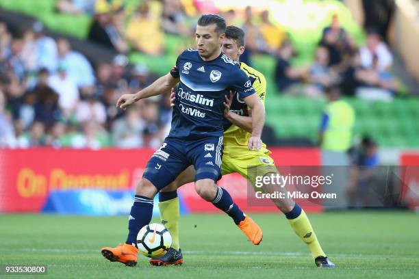 Kosta Barbarouses of the Victory kicks the ball during the round 23 A-League match between the Melbourne Victory and the Central Coast Mariners at...