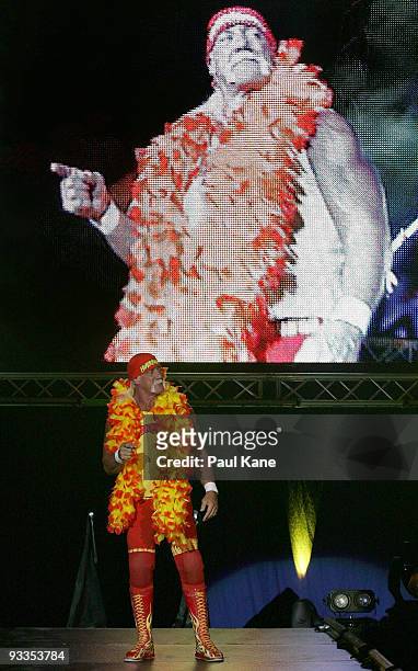 Hulk Hogan enters the stage prior to his bout against Ric Flair during the Hulkamania Tour at the Burswood Dome on November 24, 2009 in Perth,...