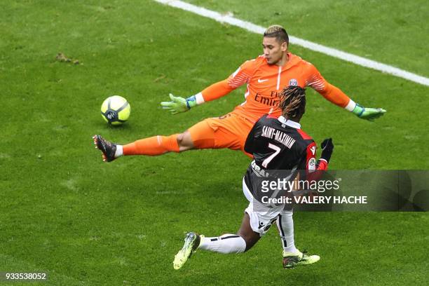 Nice's French midfielder Allan Saint-Maximin slips the ball past Paris Saint-Germain's French goalkeeper Alphonse Areola to open the scoring during...