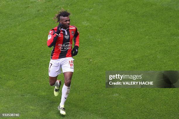 Nice's French midfielder Allan Saint-Maximin celebrates after opening the scoring during the French L1 football match Nice vs Paris Saint-Germain on...