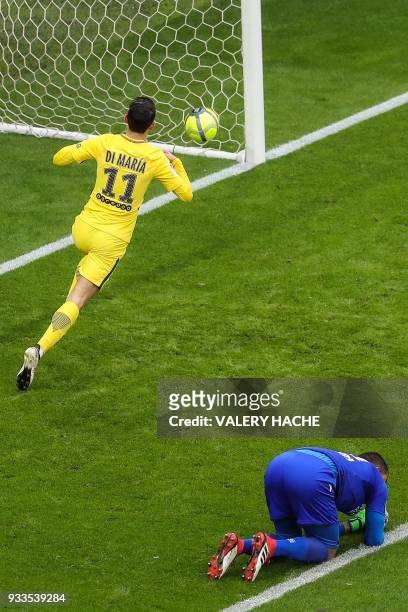 Paris Saint-Germain's Argentinian forward Angel Di Maria celebrates after scoring an equalizer past Nice's Argentinian goalkeeper Walter Benitez...