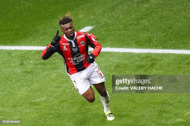 Nice's French midfielder Allan Saint-Maximin celebrates opening the scoring during the French L1 football match Nice vs Paris Saint-Germain on March...