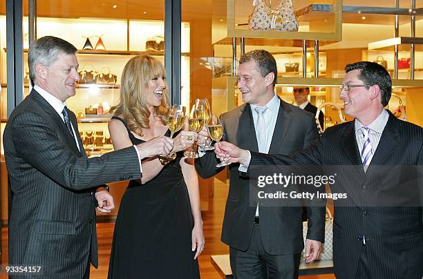 Philip Corne, Toni Collette, Jean-Baptiste Debains and David Marcun share a toast after the ribbon cutting ceremony at the opening of the new Louis...