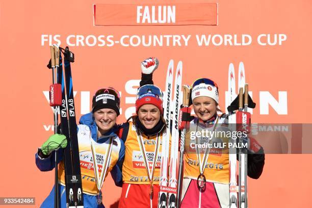 Winners of the Women's Overall Cross-Country World Cup second placed Jessica Diggins of the US, winner Heidi Weng of Norway and third placed Ingvild...