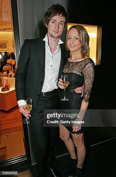 Nicholas Bolton and Jess Burrow attend the opening of the new Louis Vuitton store at Chadstone Shopping Centre on November 24, 2009 in Melbourne,...