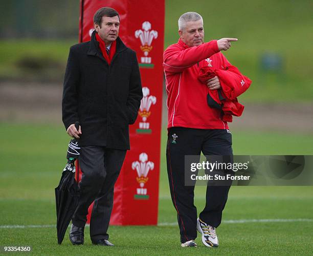 Wales head coach Warren Gatland chats with WRU Chief Executive Roger Lewis during Wales training at the Vale Resort on November 24, 2009 in Cardiff,...