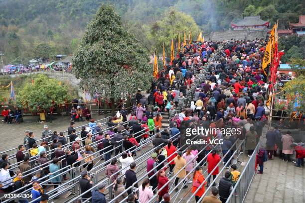 People attend 'treading on bridge' fair to pray for blessing at Jushui Town on March 17, 2018 in Mianyang, Sichuan Province of China. As a...