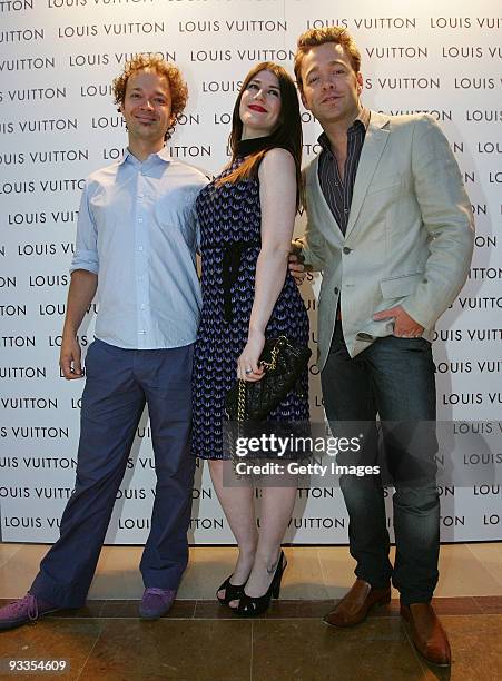 Tobie Puttock, his wife Georgie Puttock and Brodie Young attend the opening of the new Louis Vuitton store at Chadstone Shopping Centre on November...