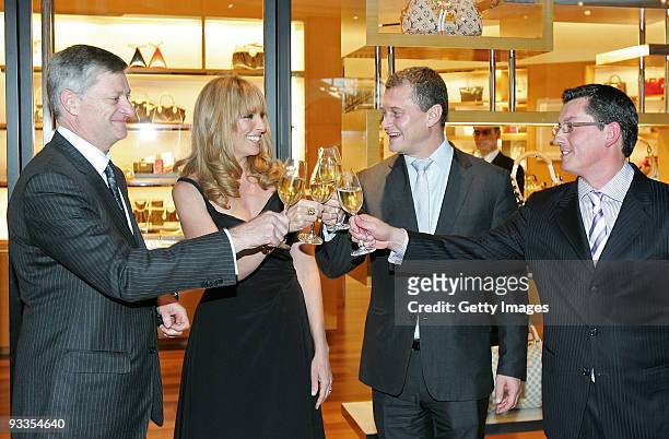 Philip Corne, Toni Collette, Jean-Baptiste Debains and David Marcun share a toast after the ribbon cutting ceremony at opening of the new Louis...