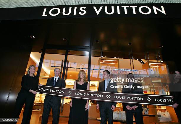 Philip Corne, Toni Collette, Jean-Baptiste Debains and David Marcun during the ribbon cutting ceremony at opening of the new Louis Vuitton store at...