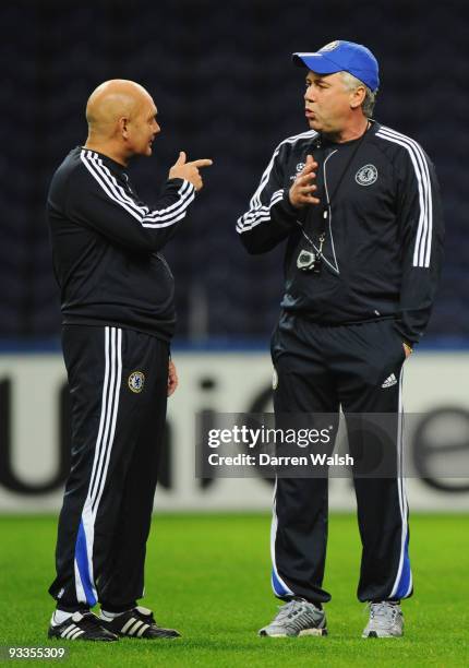 Manager Carlo Ancelotti speaks to Ray Wilkins during the Chelsea training session, prior to UEFA Champions League Group D match against FC Porto, at...