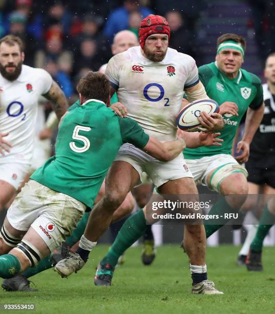 James Haskell of England is tackled by Iain Henderson during the NatWest Six Nations match between England and Ireland at Twickenham Stadium on March...