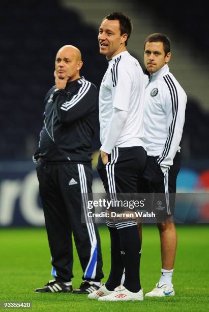 Assistant Ray Wilkins , John Terry and Joe Cole look on during the Chelsea training session, prior to UEFA Champions League Group D match against FC...