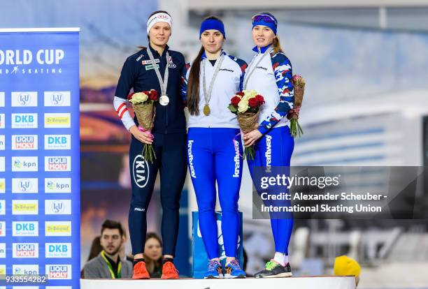 Vanessa Herzog of Austria, Angelina Golikova of Russia and Olga Fatkulina of Russia stand on the podium after the Ladies 500m 2nd race during the ISU...