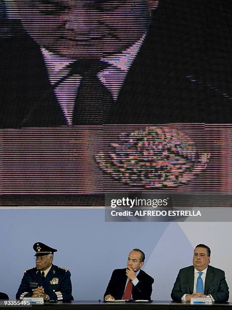 Mexico's Secretary of National Defense Guillermo Galvan, President Felipe Calderon and the Secretary of the Mexican Federal Police Genaro Garcia Luna...