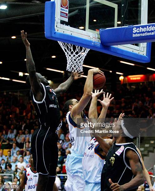 Ade Dagrundo of Mitteldeutscher BC is blocked by Jeff Gibbs of Bremerhaven during the Beko Basketball Bundesliga game between Eisbaeren Bremerhaven...