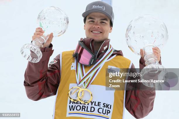 Mikael Kingsbury of Canada wins the globe in the overall standings during the FIS Freestyle Ski World Cup Men's and Women's Moguls Finals on March...