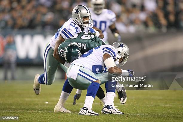 Running back LeSean McCoy of the Philadelphia Eagles is tackled by linebacker Bradie James of the Dallas Cowboys during a game on November 8, 2009 at...