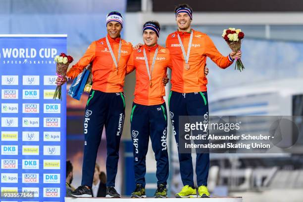 Dai Dai Ntab of the Netherlands, Jan Smeekens of the Netherlands and Hein Otterspeer of the Netherlands stand on the podium after the Men's 500m...