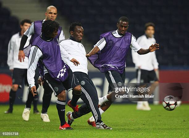 Florent Malouda, Michael Essien and Gael Kakuta battle for the ball during the Chelsea training session, prior to UEFA Champions League Group D match...