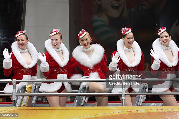 The Rockettes pose with their wax figure outside Madame Tussauds on November 24, 2009 in New York City.