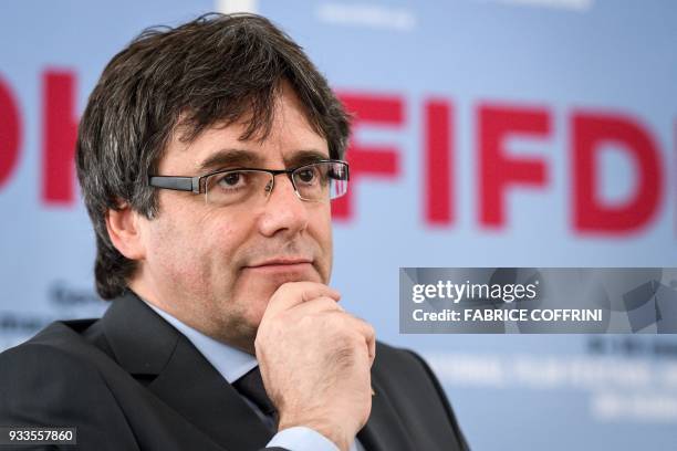 Catalonia's deposed leader Carles Puigdemont gestures during an interview on the sideline of the International film festival and forum of the human...