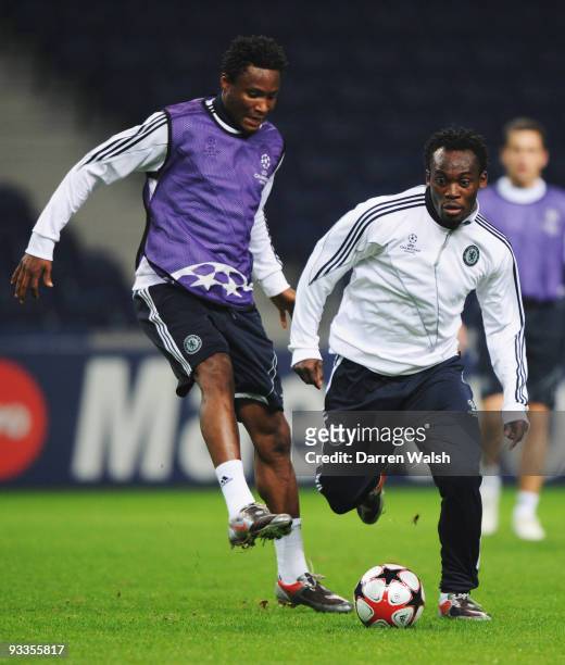 Michael Essien and John Obi Mikel in action during the Chelsea training session, prior to UEFA Champions League Group D match against FC Porto, at...