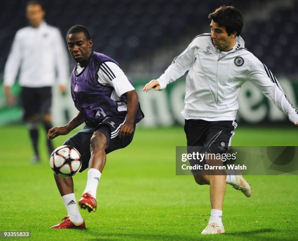 Deco and Gael Kakuta battle for the ball during the Chelsea training session, prior to UEFA Champions League Group D match against FC Porto, at the...