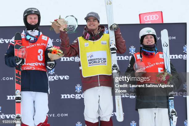 Mikael Kingsbury of Canada takes 1st place, Benjamin Cavet of France takes 2nd place, Bradley Wilson of USA takes 3rd place during the FIS Freestyle...