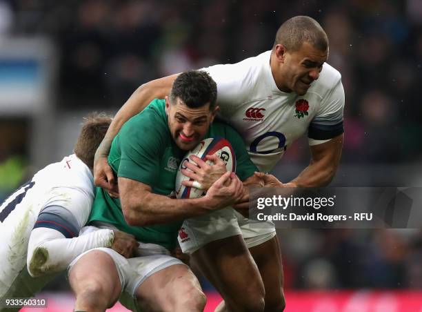 Rob Kearney of Ireland is tackled by Jonny May and Jonathan Joseph during the NatWest Six Nations match between England and Ireland at Twickenham...