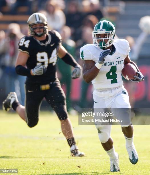 Edwin Baker of the Michigan State Spartans runs the ball during action against the Purdue Boilermakers at Ross-Ade Stadium on November 14, 2009 in...