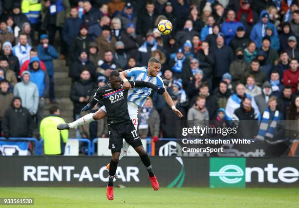 Crystal Palace's Christian Benteke and Huddersfield Town's Mathias Zanka Jorgensen during the Premier League match between Huddersfield Town and...