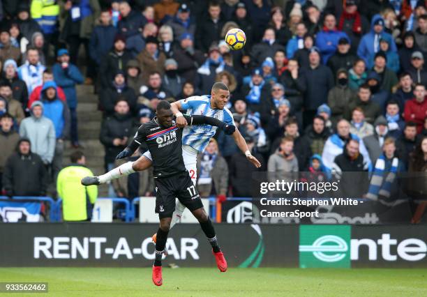 Crystal Palace's Christian Benteke and Huddersfield Town's Mathias Zanka Jorgensen during the Premier League match between Huddersfield Town and...