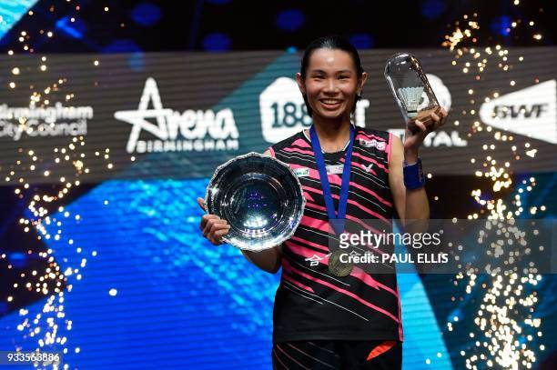Taiwan's Tai Tzu-ying poses on the podium after beating Japan's Akane Yamaguchi in the women's singles final at the All England Open Badminton...