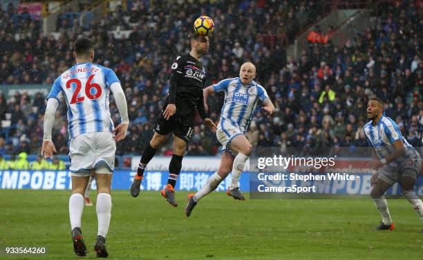 Crystal Palace's James McArthur watched by Huddersfield Town's Aaron Mooy during the Premier League match between Huddersfield Town and Crystal...