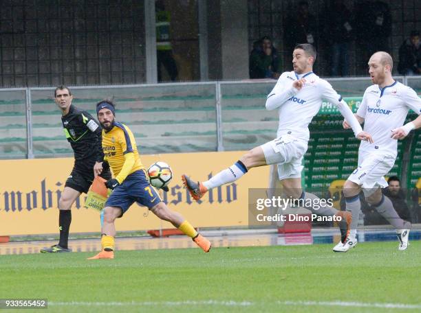 Daniele Verde of Hellas Verona competes with Andrea Petagna of Atalanta BC during the serie A match between Hellas Verona FC and Atalanta BC at...