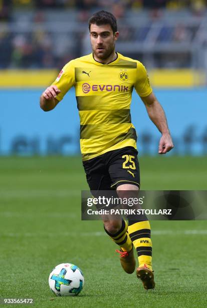 Dortmund's Greek defender Sokratis plays the ball during the German first division Bundesliga football match Borussia Dortmund vs Hanover 96, in...